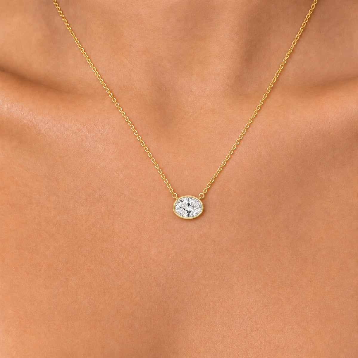 Lab-Grown Diamond Oval Solitaire Bezel Pendant Necklace in 14K White Gold or 14K Yellow Gold