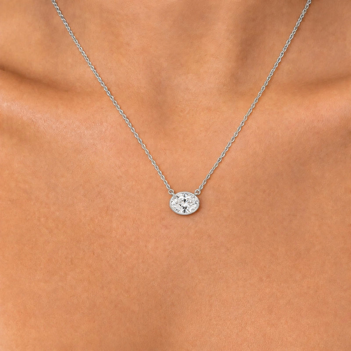 Lab-Grown Diamond Oval Solitaire Bezel Pendant Necklace in 14K White Gold or 14K Yellow Gold