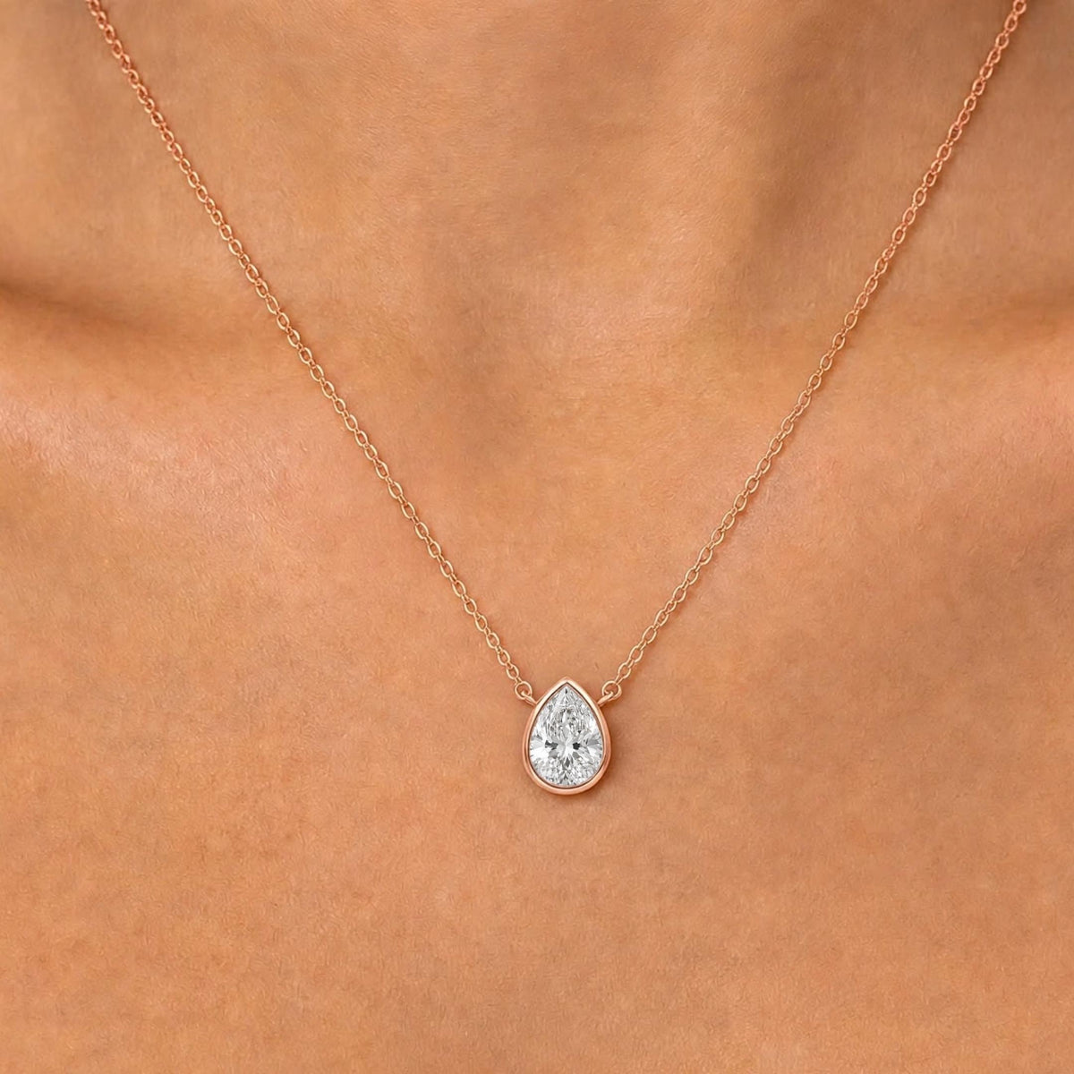 Lab-Grown Diamond Pear Solitaire Bezel Pendant Necklace in 14K White Gold or 14K Yellow Gold