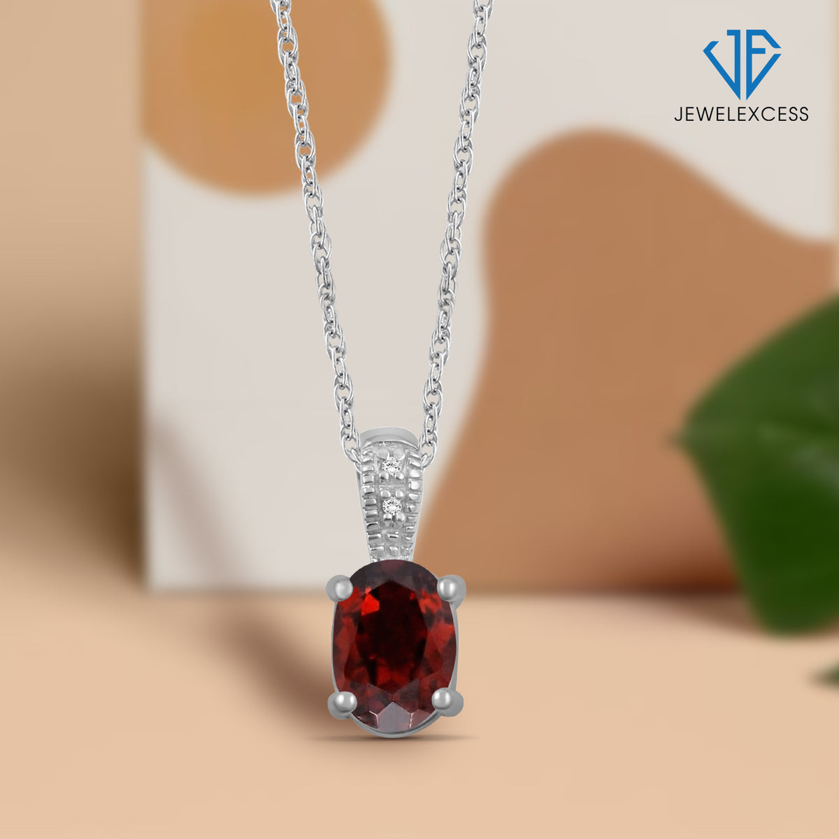 1 ct. T.G.W. Garnet Pendant with Diamond Accent in Sterling Silver