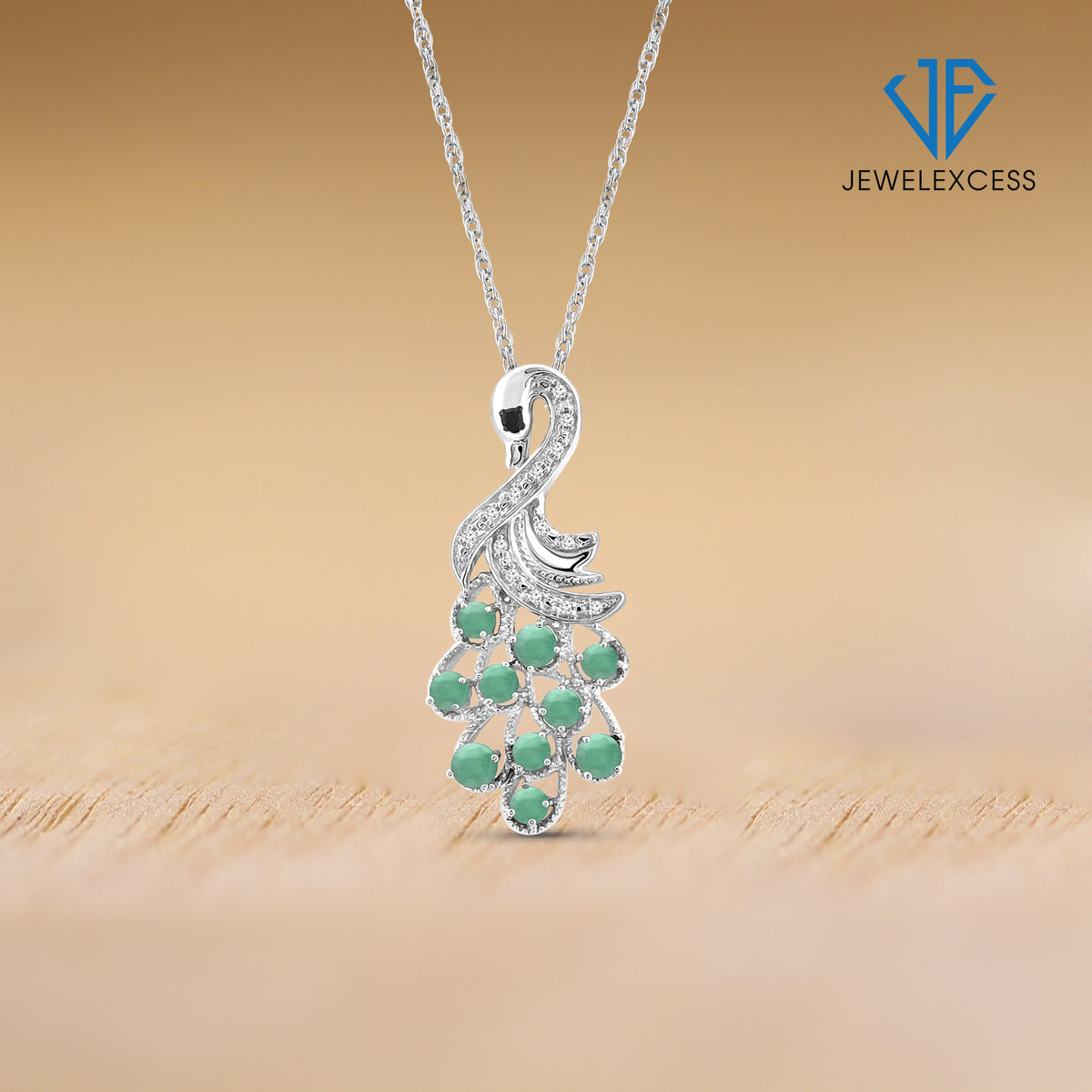 1/2 ct. T.G.W. Emerald Pendant with Black & White Diamond Accent in Sterling Silver