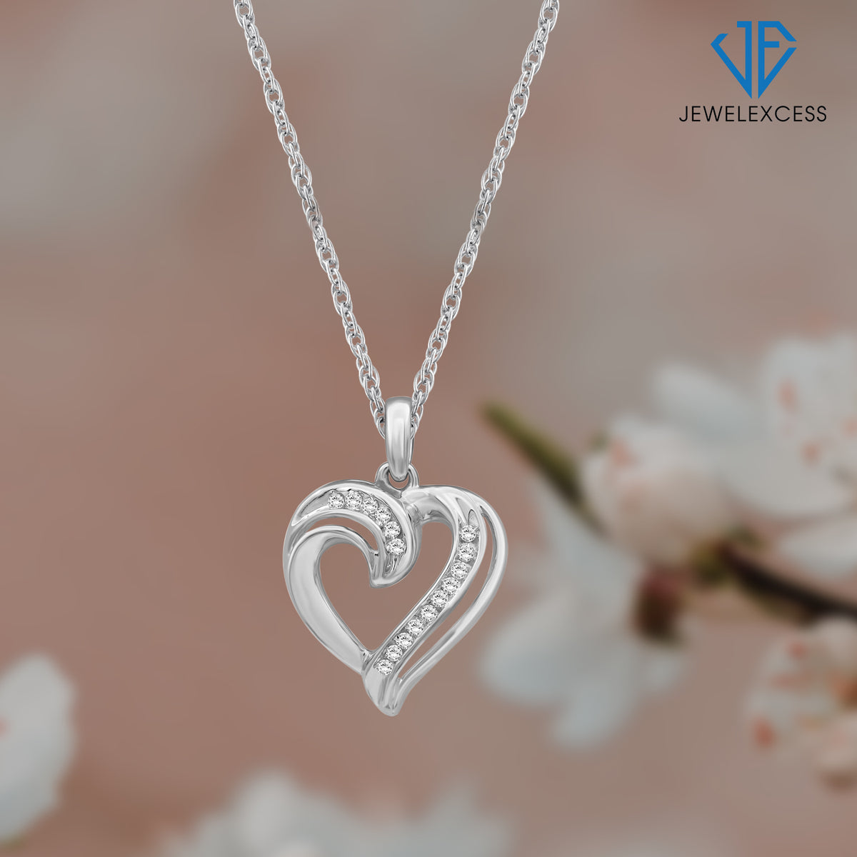 1/7 ct. T.W. White Diamond Heart Pendant in Sterling Silver