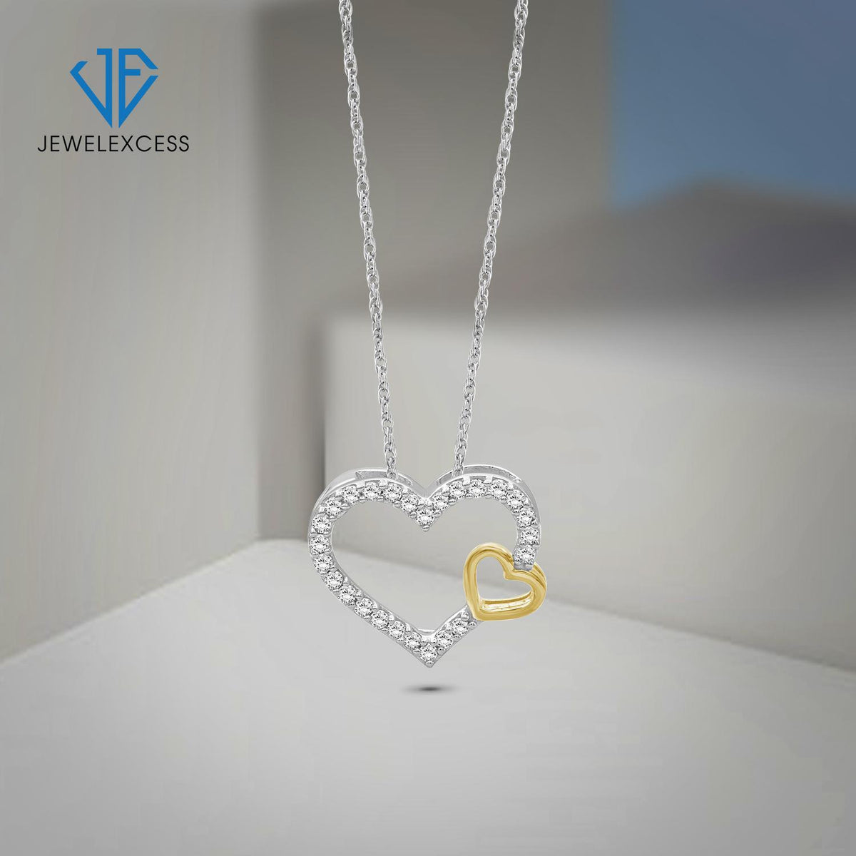 1/4 ct. T.W. White Diamond Heart Pendant in Two-Tone Sterling Silver