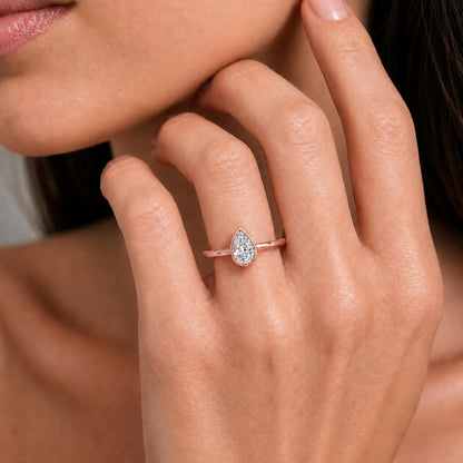 1 to 6 ct. T.W. Lab-Grown Diamond Pear Cut Solitaire Bezel Engagement Ring in 14K White Gold or 14K Yellow Gold