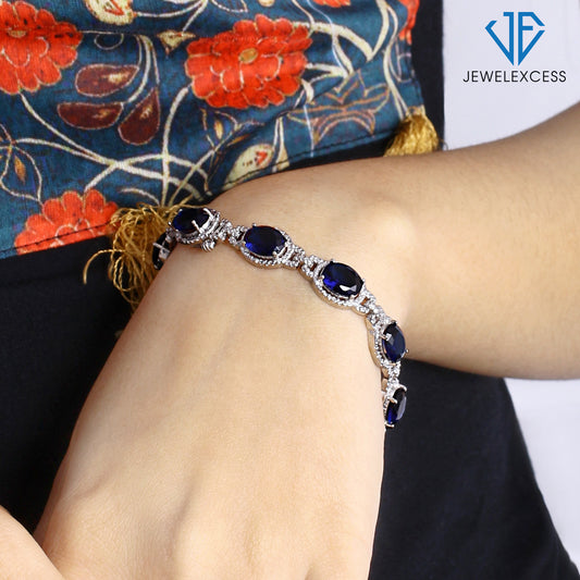 14 ct. T.G.W. Created Sapphire Halo Bracelet with Diamond Accents in Sterling Silver