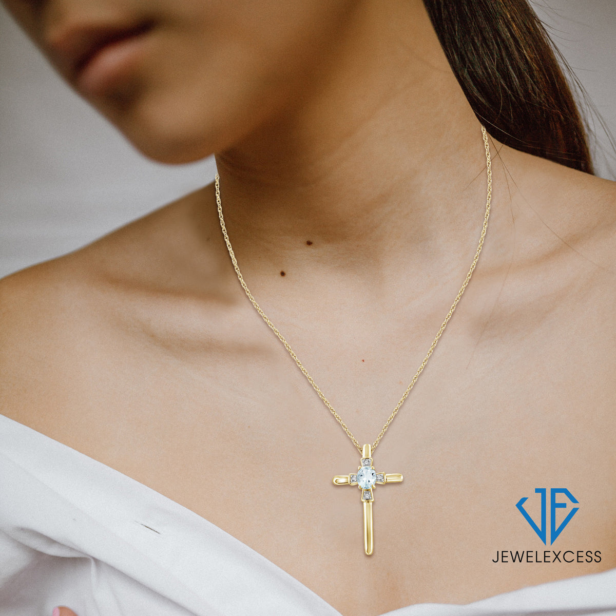1/4 ct. T.G.W. Aquamarine Cross Pendant with Diamond Accent in 14K Gold over Silver